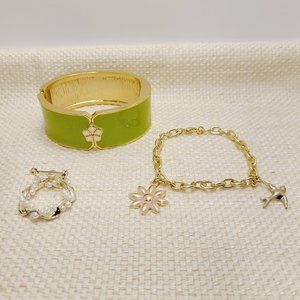 Set of 3 matching gold tone bracelets and brooch.